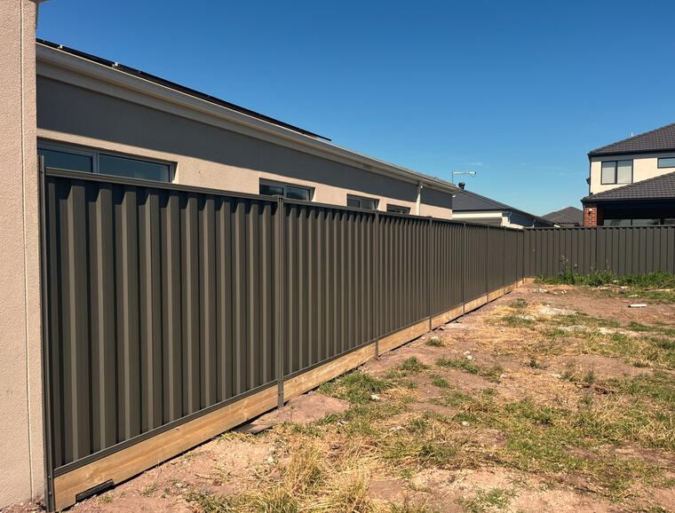 Colorbond fence Woodland Grey with timber sleepers installed in Officer